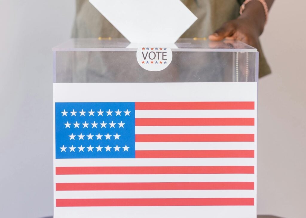 Photo of a voting box with US flag